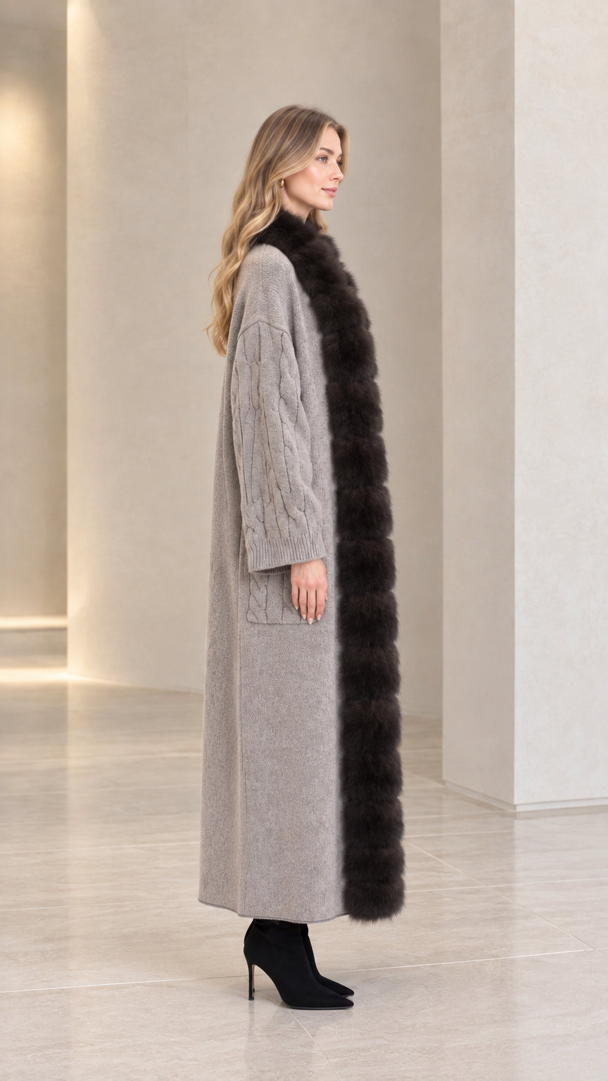 Side profile view of grey longline faux fur trim knit duster coat