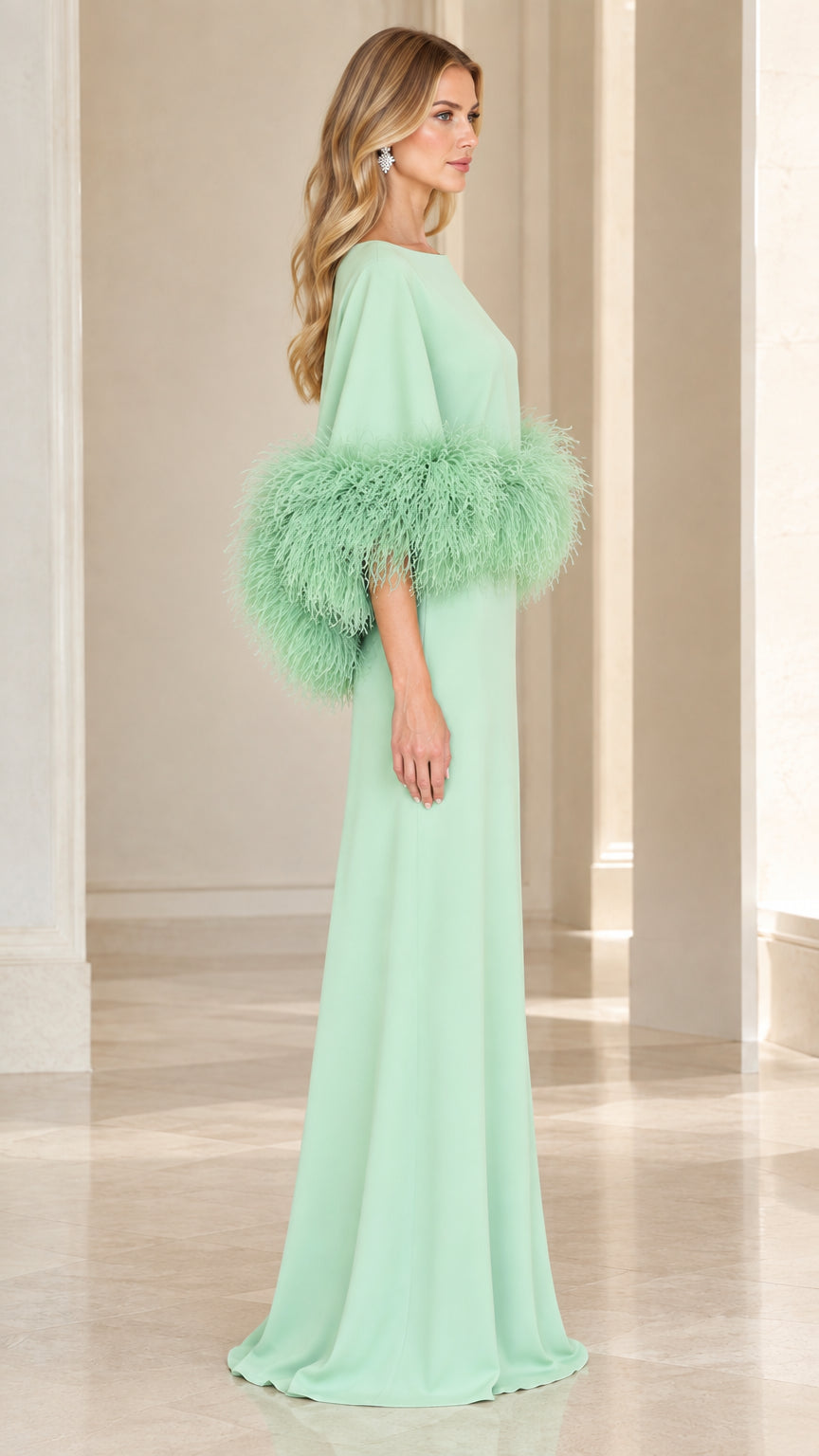 Side profile of model wearing mint green floor-length formal gown with feather sleeves