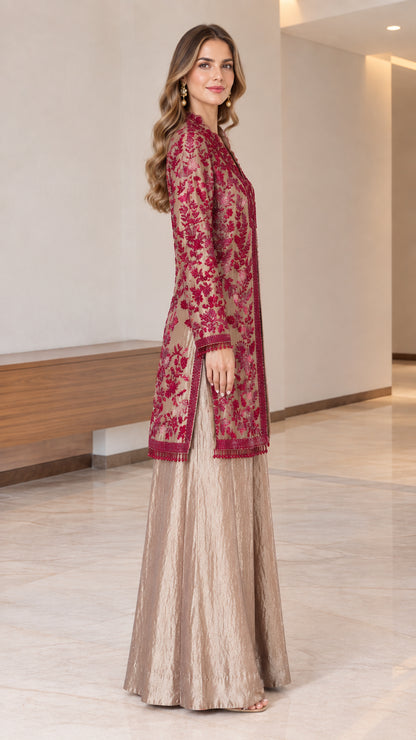 Side view of model wearing embroidered tunic and flowing palazzo trousers