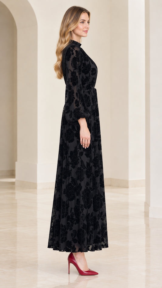 Side profile view of black long sleeve velvet burnout maxi dress