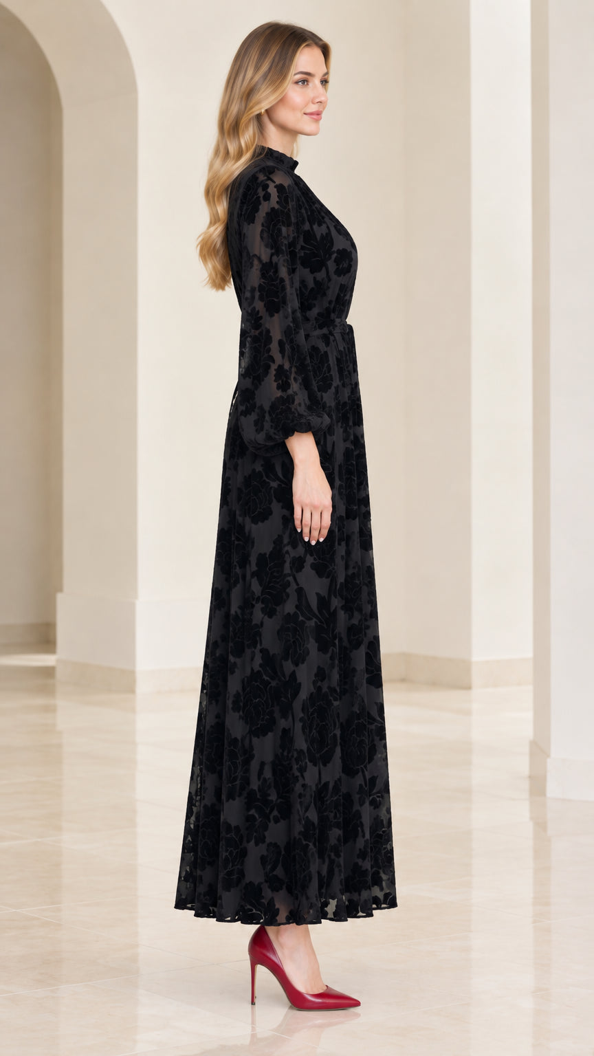 Side profile view of black long sleeve velvet burnout maxi dress