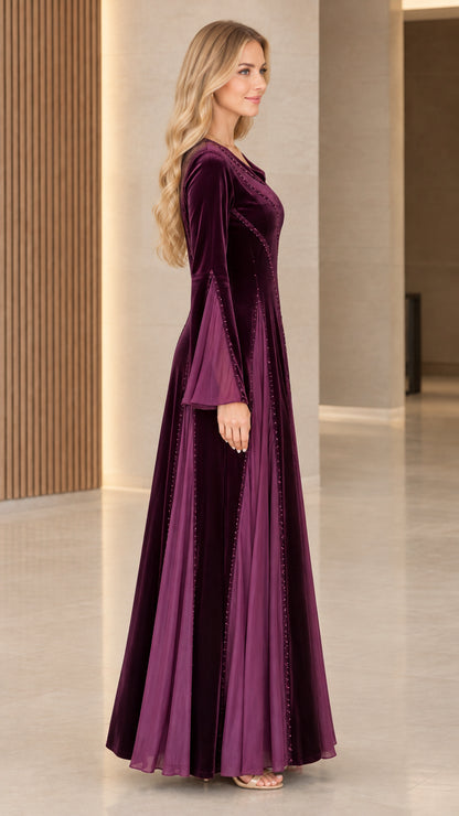 Plum velvet maxi dress side profile showing sleeve drape and paneled skirt