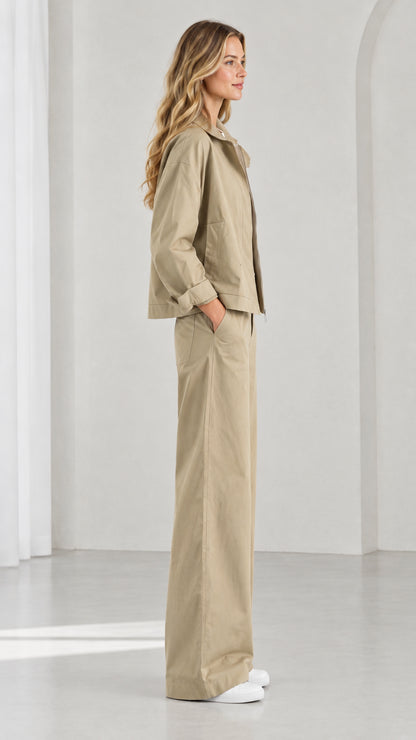 Side profile view of women's khaki matching jacket and wide-leg trousers