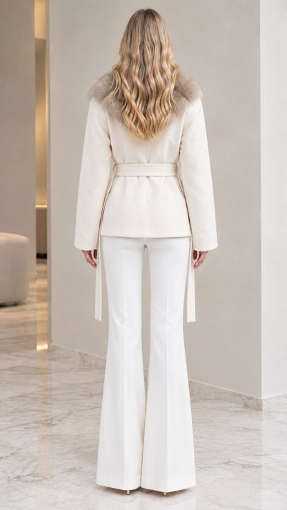 Back view of model in ivory belted wrap jacket