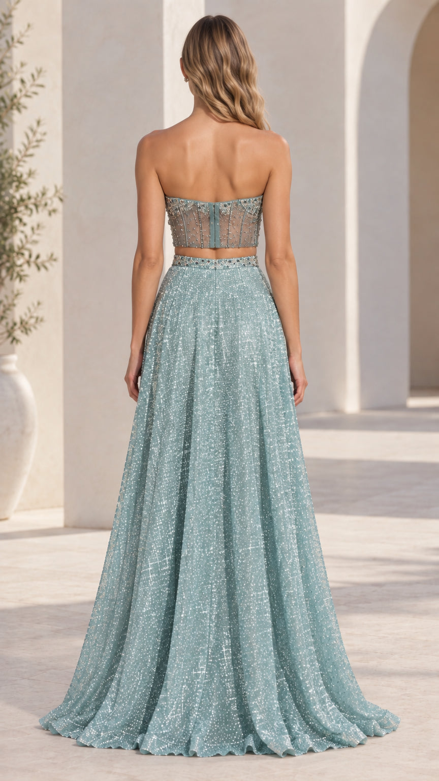 Back view of model wearing dusty blue two-piece glitter maxi evening gown