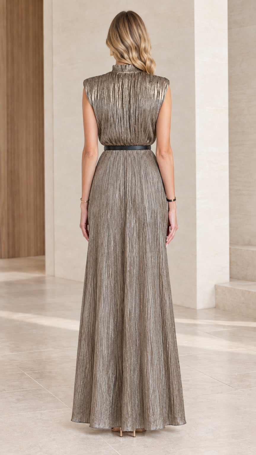 Back view of floor-length champagne gold pleated metallic dress