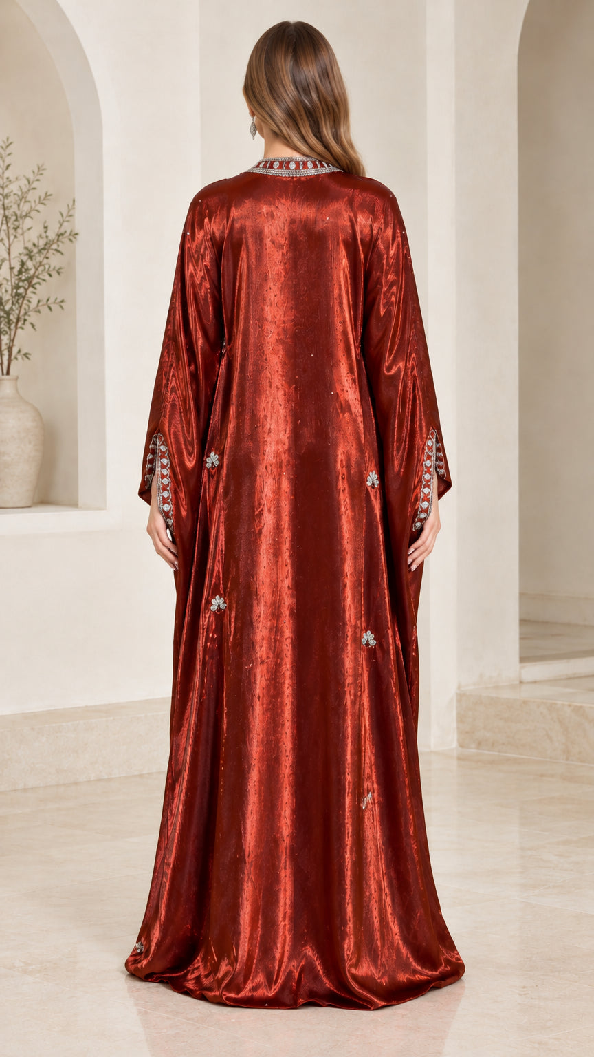 Back view of rust red flowy shimmer kaftan evening gown