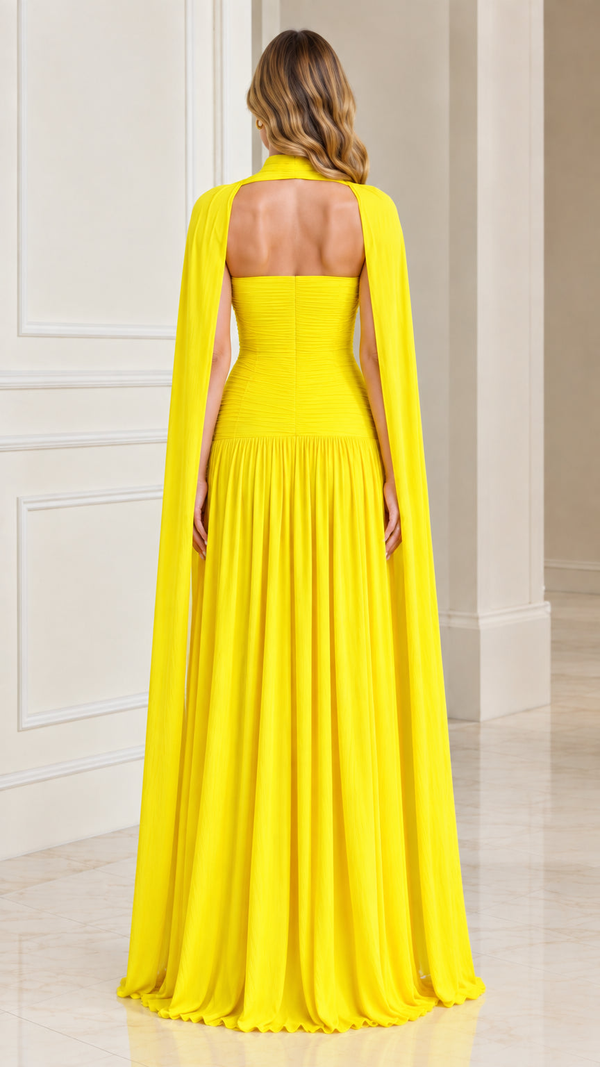 Yellow evening maxi dress with open back and flowing floor-length cape back view