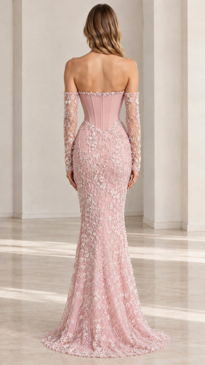 Back view of woman wearing Dusty Pink strapless mermaid dress with sweep train