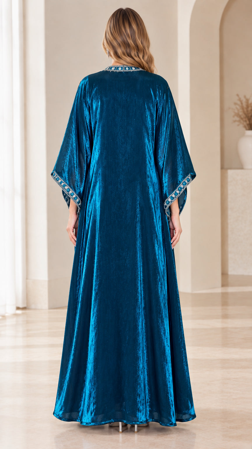 Back view of teal blue velvet kaftan maxi dress showcasing flowy silhouette