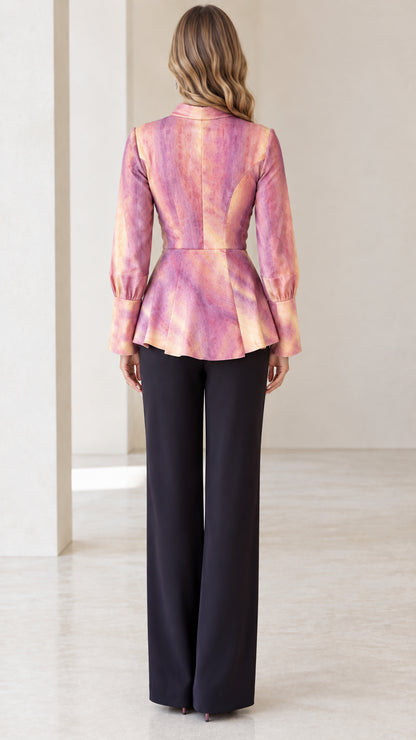 Back view of model in Blush Pink tailored peplum blouse with contoured seams