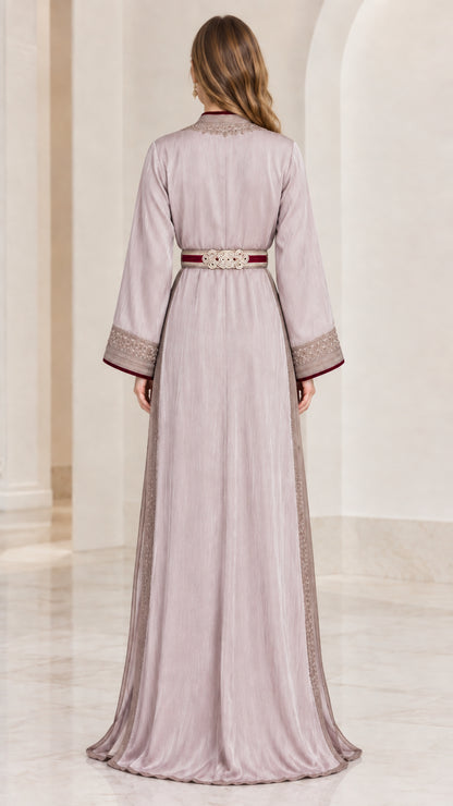 Back view of woman wearing elegant dusty lilac floor-length kaftan dress