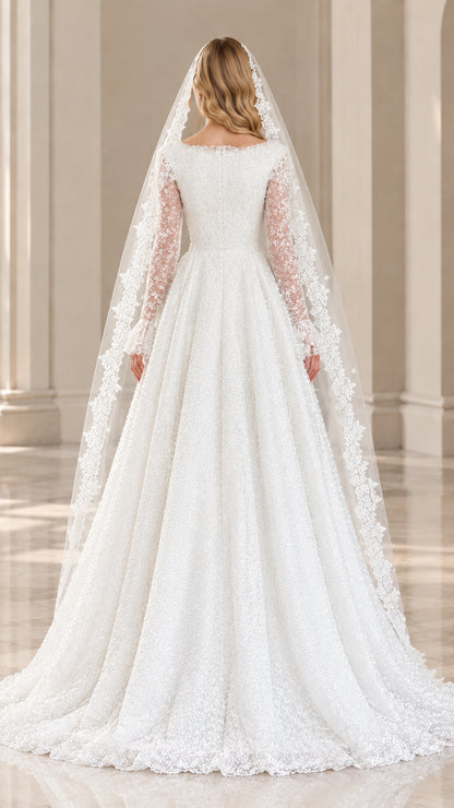Back view of white sequin lace wedding gown showing train and veil