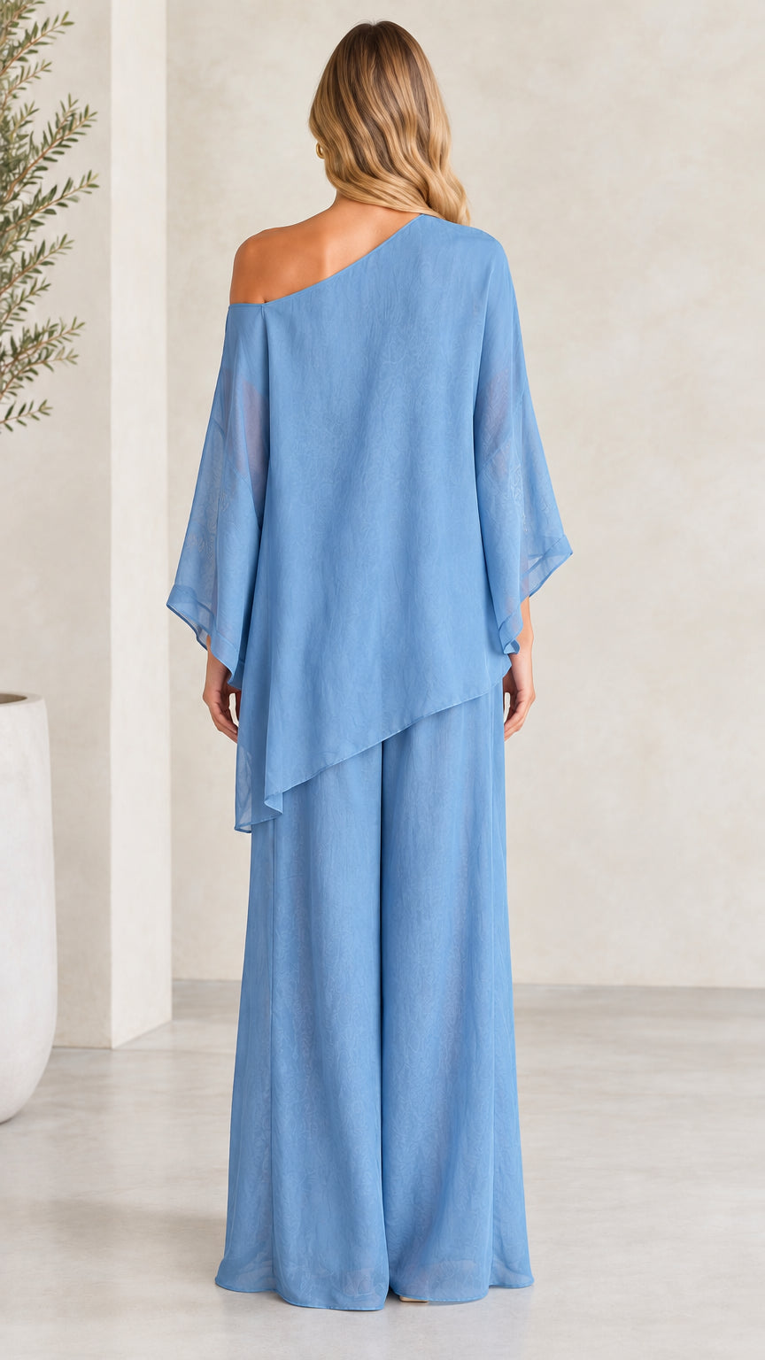 Back view of woman wearing Dusty Blue asymmetric one-shoulder two-piece outfit