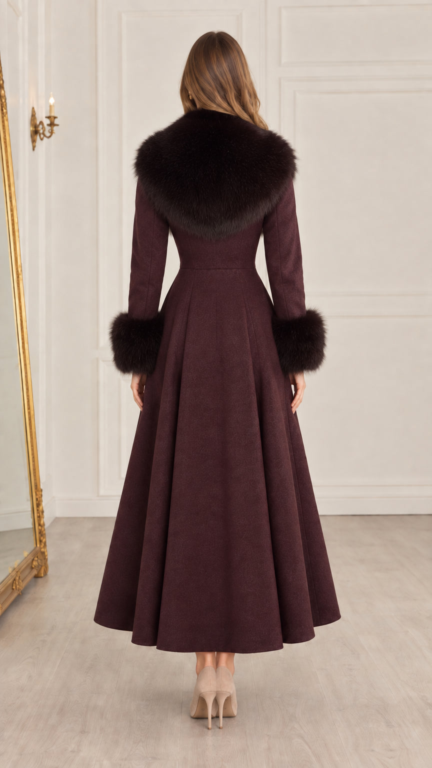 Back view of burgundy maxi swing coat showing tailored waist and full flare skirt