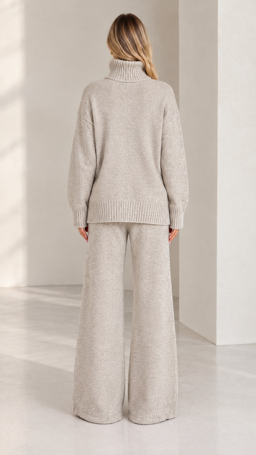 Back full view of women wearing heather grey turtleneck sweater and wide leg pants set