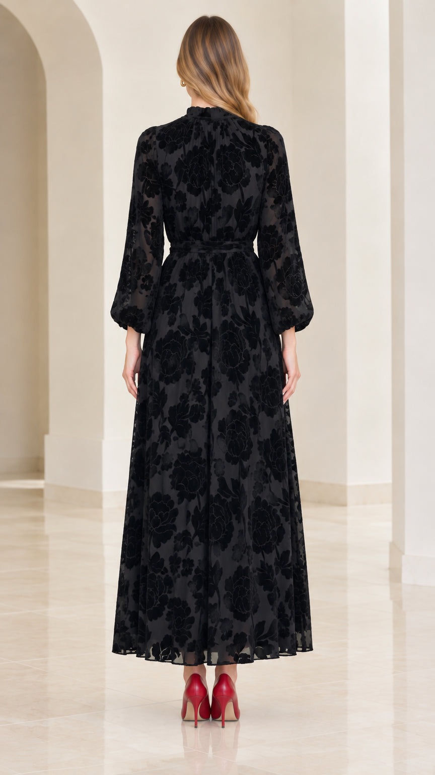 Back view of model wearing black mock neck floral maxi dress