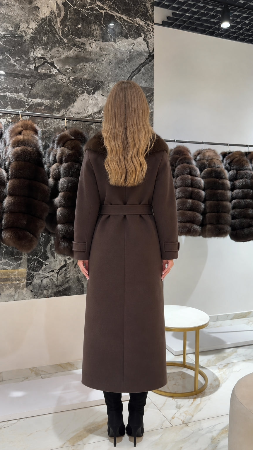 Back view of woman wearing a long tailored brown wool-blend coat