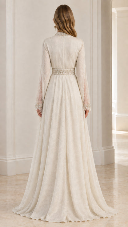 Back view of ivory long sleeve formal gown with flowing train skirt