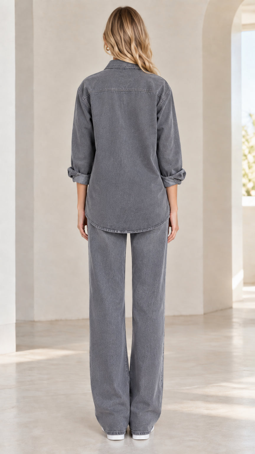 Back view of model showcasing washed grey relaxed button-down shirt and wide-leg trousers