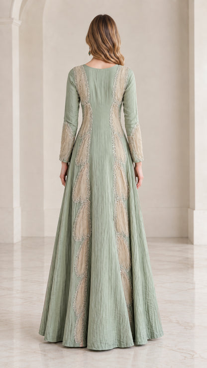 Back view of sage green floor length formal dress showing panel construction