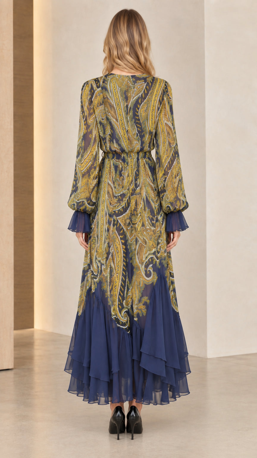 Back view of model wearing Navy Blue tiered paisley chiffon maxi dress