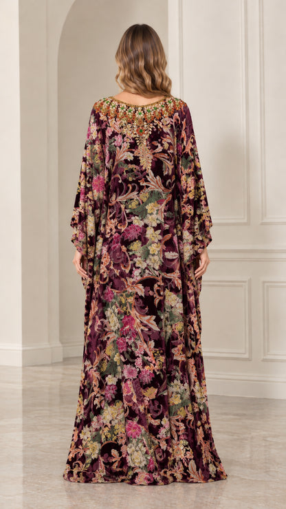 Back view of woman wearing Plum floral velvet kaftan maxi dress