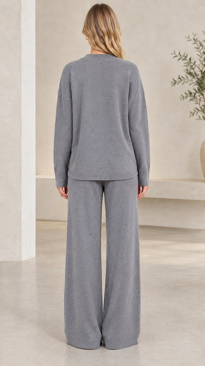 Back view of women's heather grey knit crewneck top and wide-leg trousers