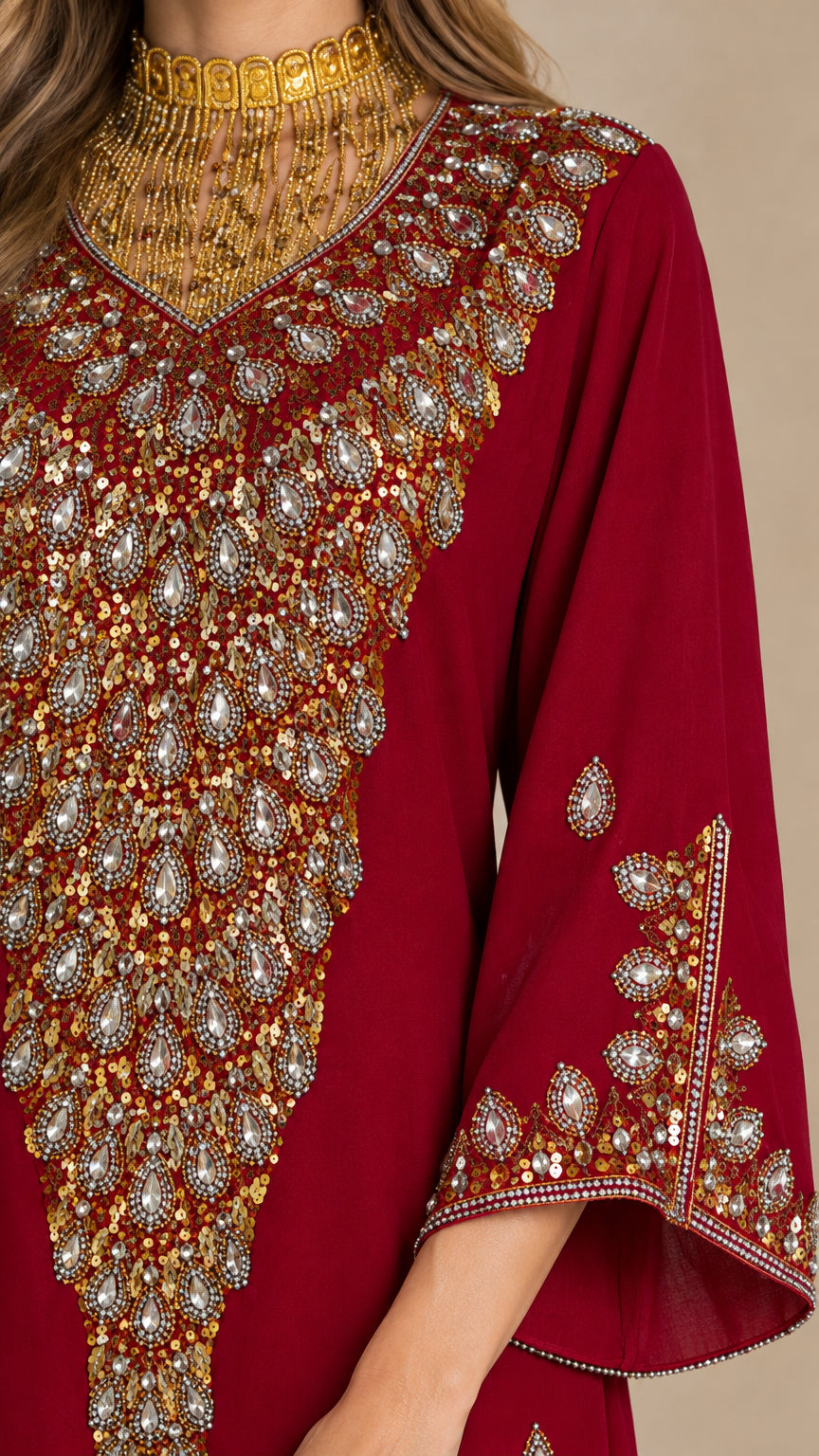 Close-up detail of ornate gold and crystal beaded neckline and cuff