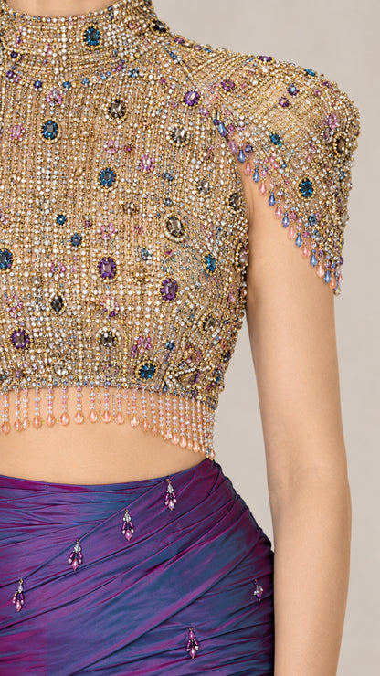 Close-up detail of multi-color crystal beading and fringe on high-neck crop top