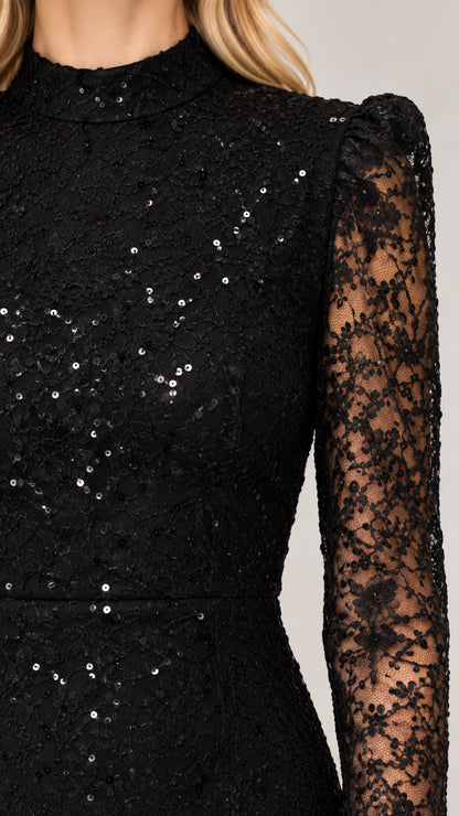Close-up detail of black floral lace fabric with sparkling sequin embellishments