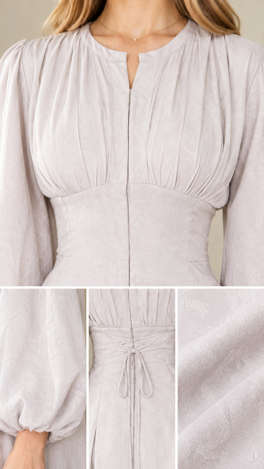 Close-up details of pleated bodice, split neckline, and textured fabric