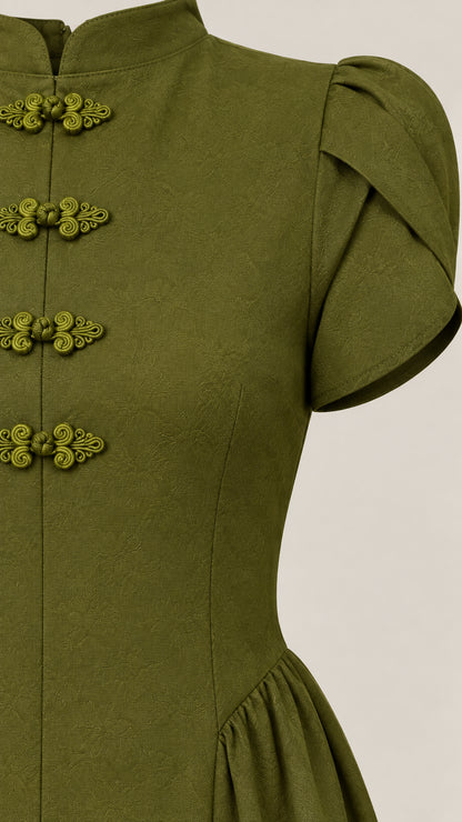Close-up detail of mandarin collar, traditional frog buttons, and puff sleeve on olive green dress