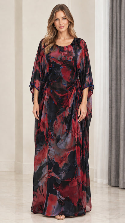 Front view of model wearing black multi floral watercolor draped kaftan maxi dress