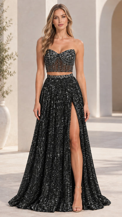 Model wearing black two-piece embellished corset evening gown with high leg slit