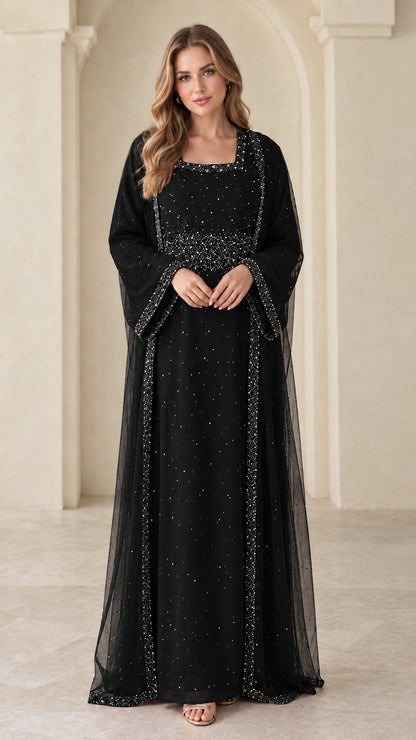 Front view of model wearing black beaded layered abaya maxi dress