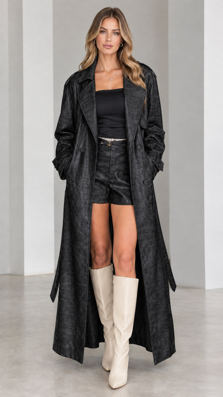 Full-length front view of black croc-embossed longline trench coat