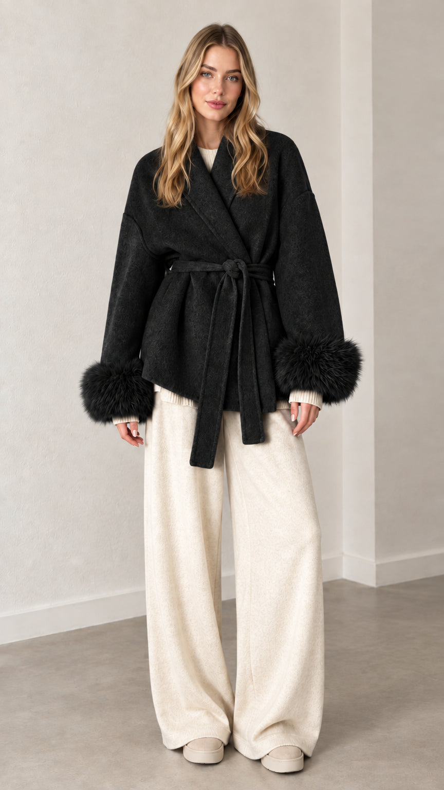 Front view of black belted wrap coat with matching black faux fur cuffs