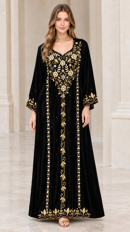 Full-length view of black embroidered velvet kaftan dress