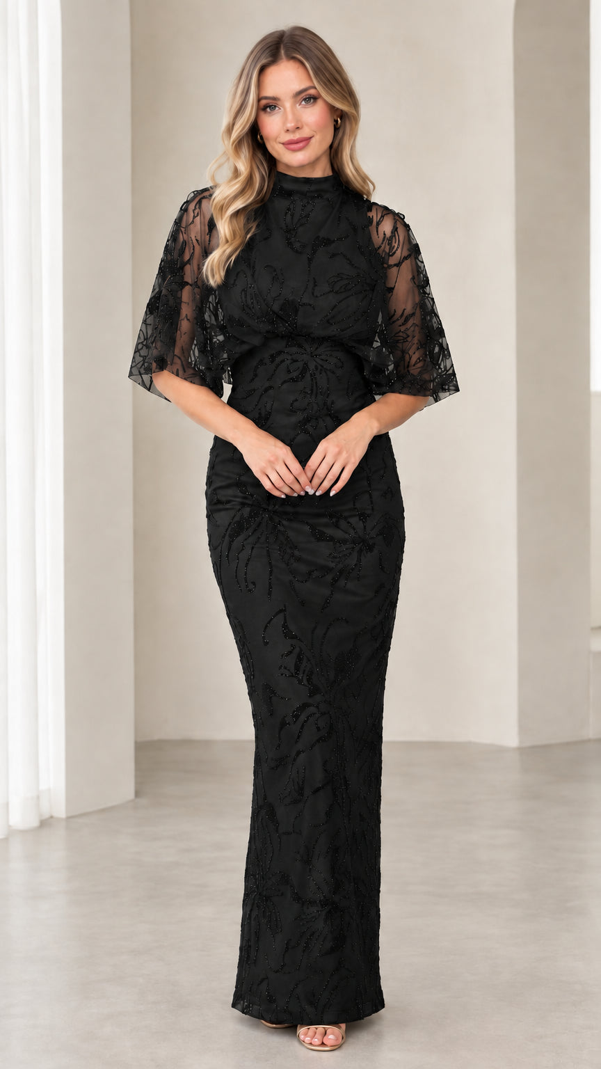 Model wearing Black high neck beaded evening gown with capelet sleeves