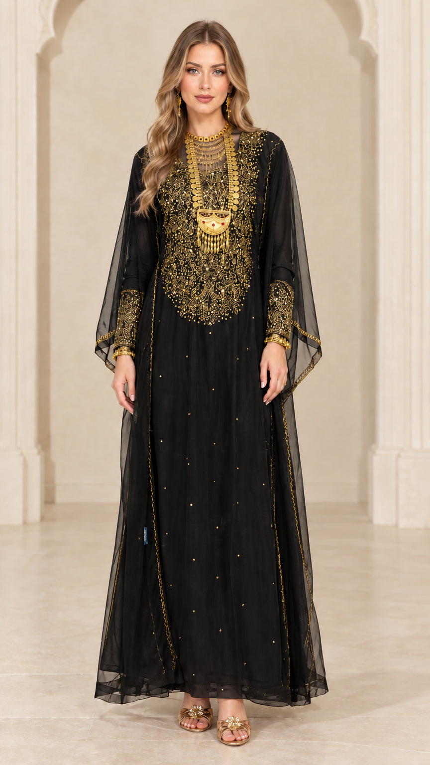 Front view of woman wearing black embroidered sheer overlay maxi kaftan gown