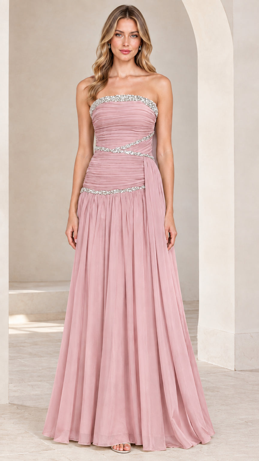 Front view of model wearing dusty rose strapless rhinestone ruched chiffon evening gown