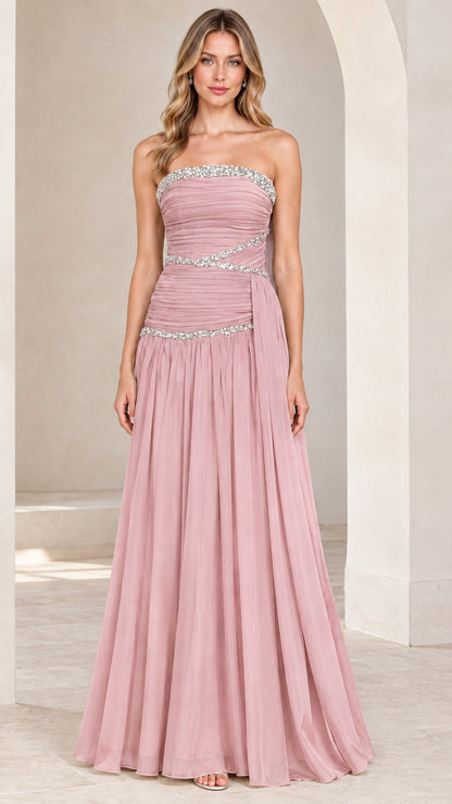 Front view of model wearing dusty rose strapless rhinestone ruched chiffon evening gown