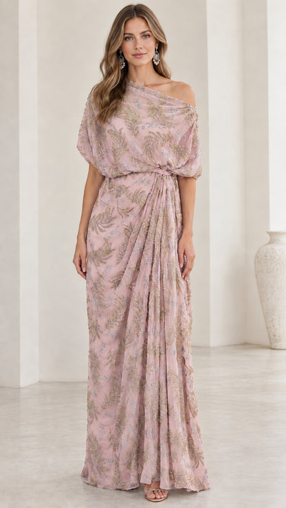 Woman wearing blush pink one-shoulder embroidered draped evening dress