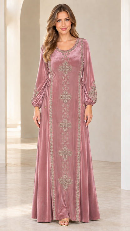 Front view of model wearing dusty rose pink embroidered velvet maxi dress