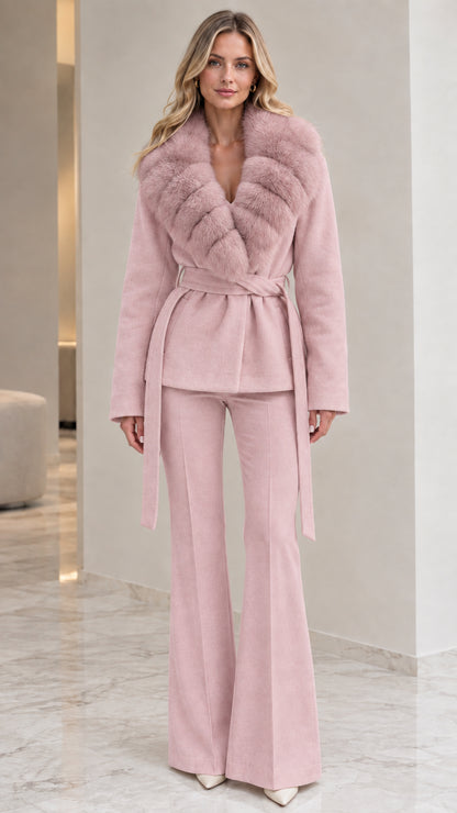Model wearing dusty pink belted wrap coat with plush collar