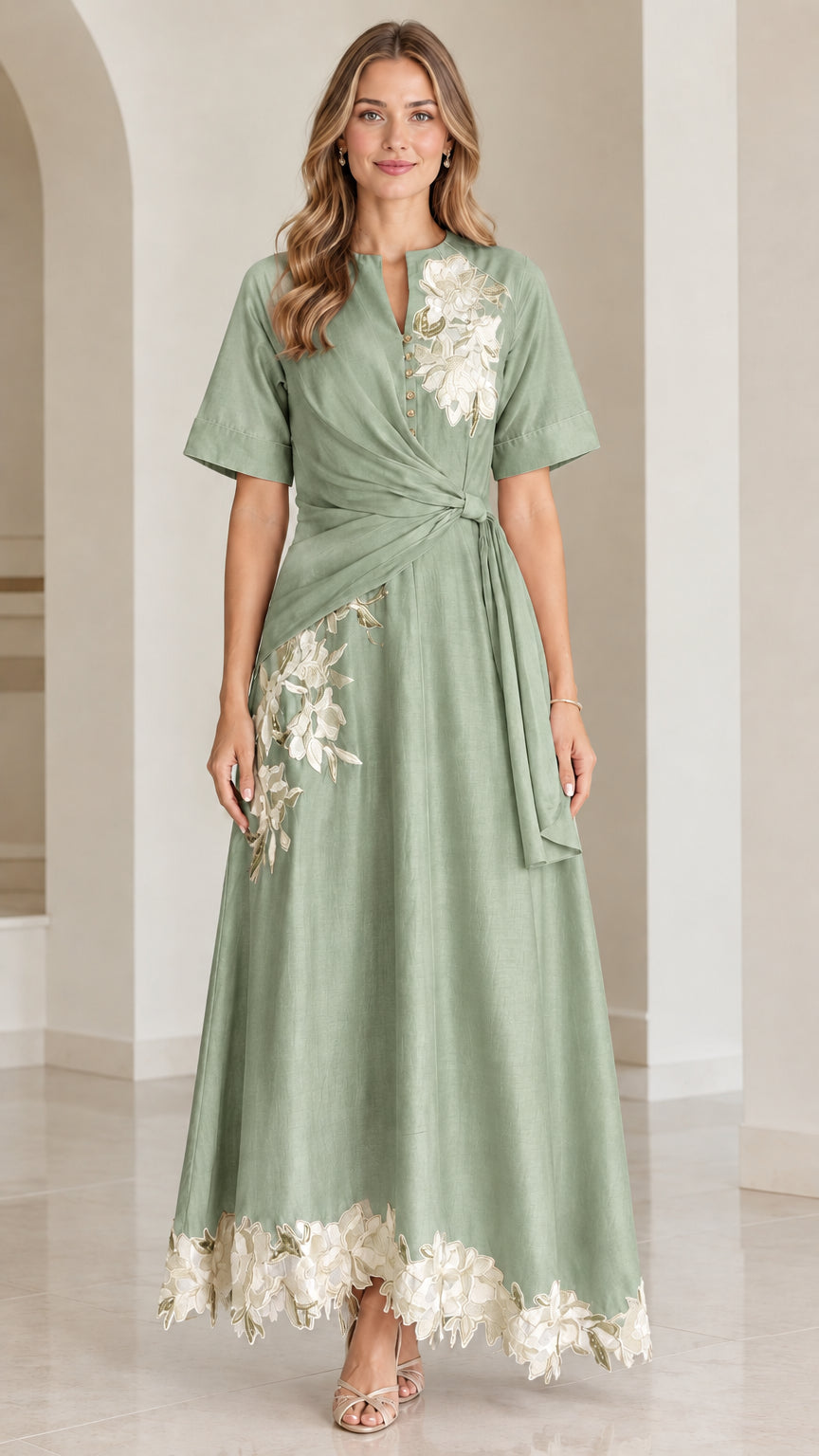 Front view of sage green floral embroidered twist-waist maxi dress