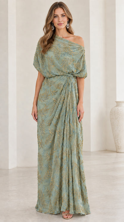 Woman wearing sage green one-shoulder embroidered draped evening dress