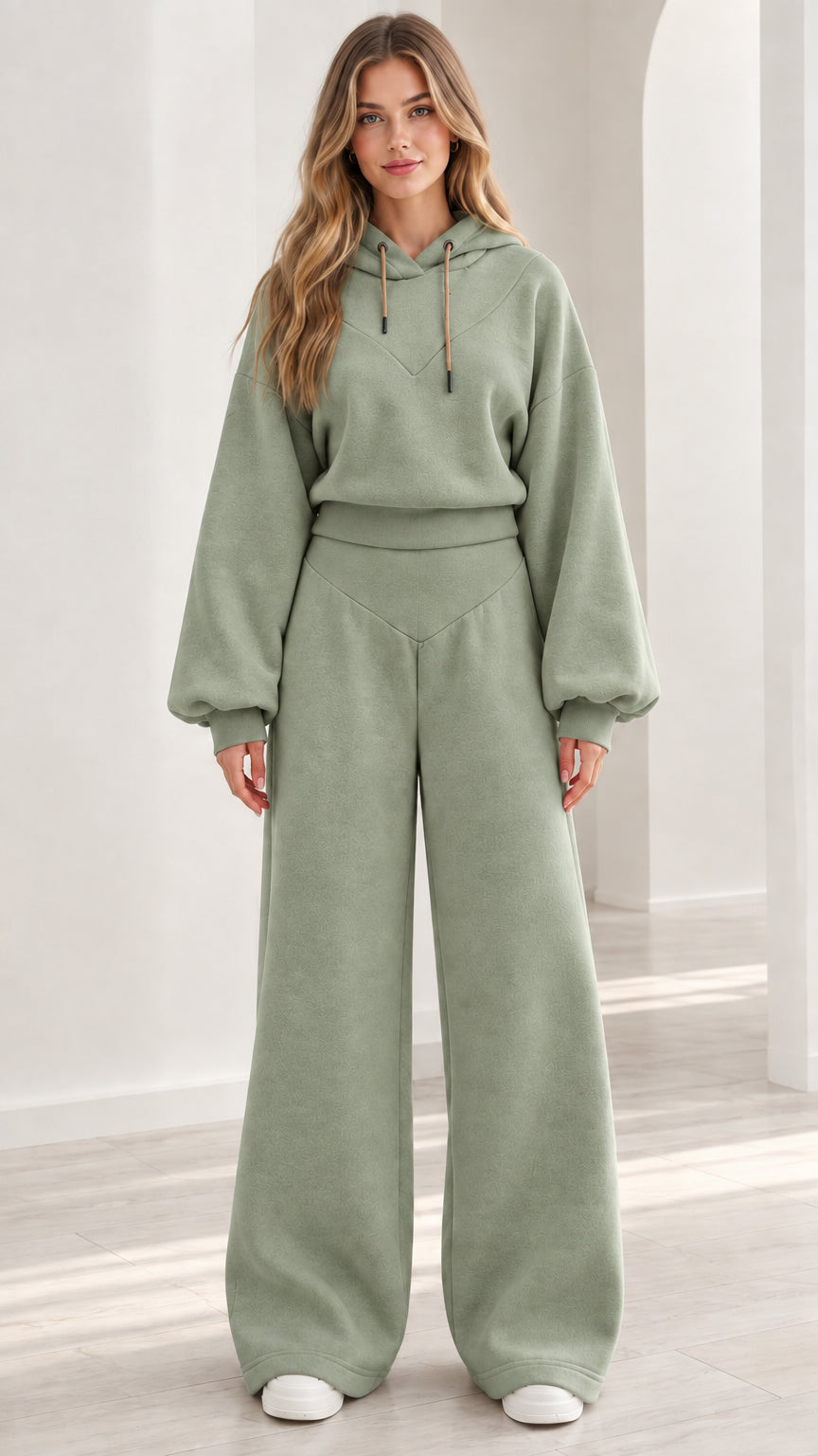 Model wearing sage green 2-piece fleece hoodie and wide-leg pants set