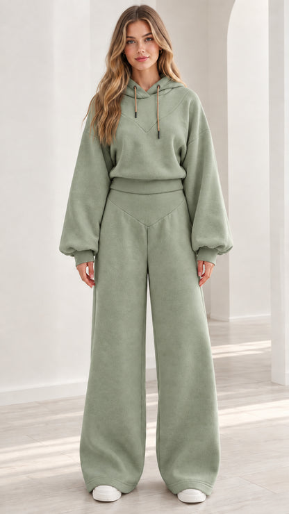 Model wearing sage green 2-piece fleece hoodie and wide-leg pants set